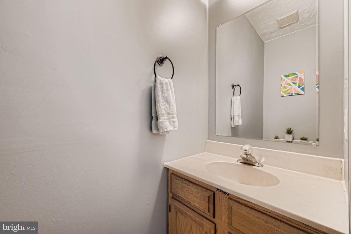 3329 Betterton Circle Abingdon, MD 21009 - Photo 15 of 38 a bathroom with a sink and a mirror