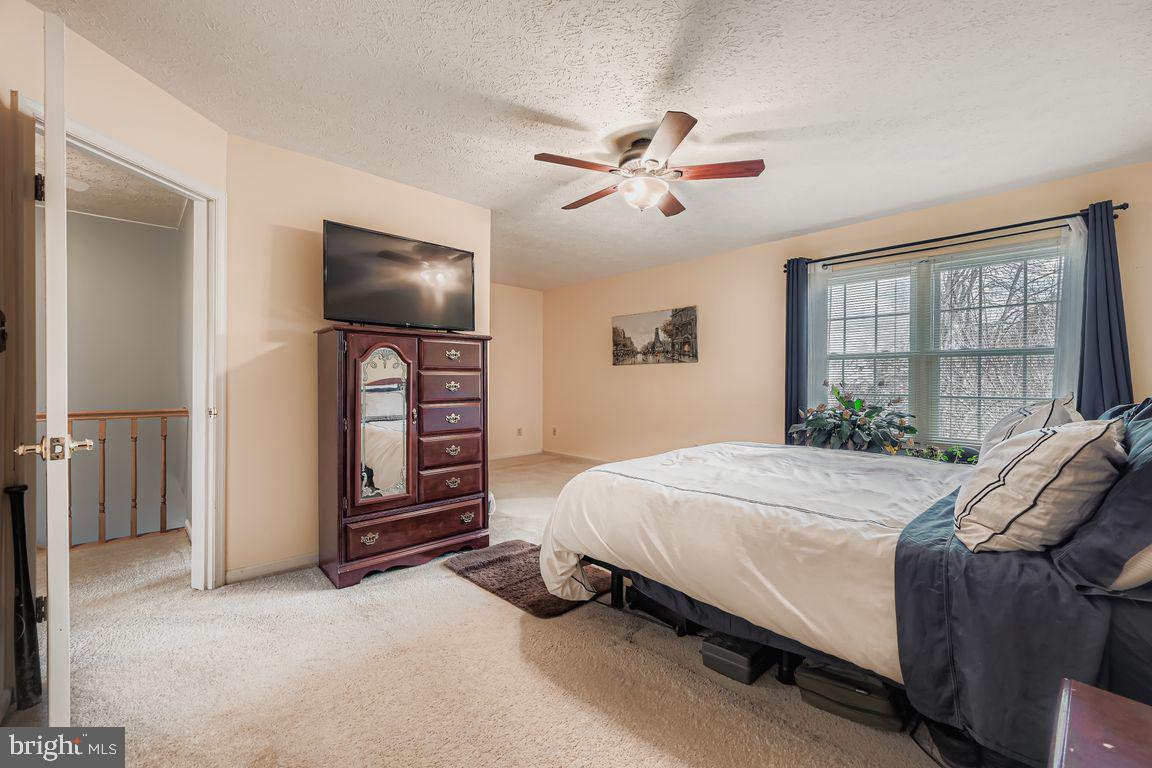 3329 Betterton Circle Abingdon, MD 21009 - Photo 17 of 38 a bedroom with a bed and a flat screen tv