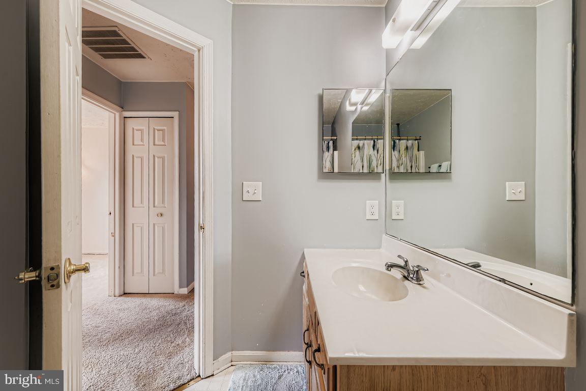 3329 Betterton Circle Abingdon, MD 21009 - Photo 19 of 38 a bathroom with a sink and mirror