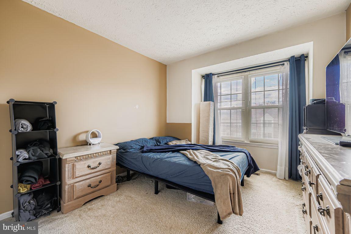 3329 Betterton Circle Abingdon, MD 21009 - Photo 21 of 38 a bedroom with a bed and a tv on the dresser