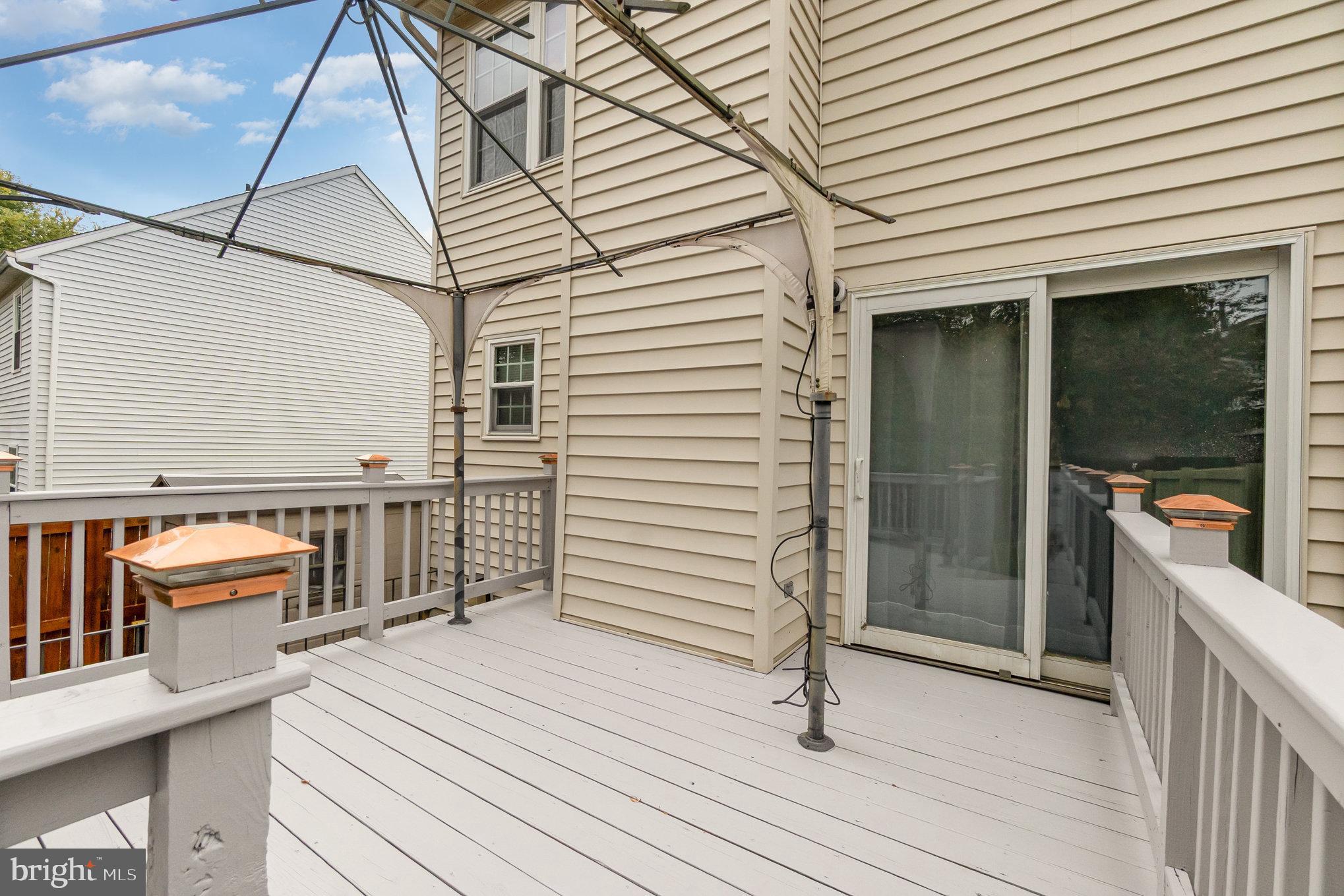 3329 Betterton Circle Abingdon, MD 21009 - Photo 30 of 38 a view of a patio with a table and chairs and wooden floor