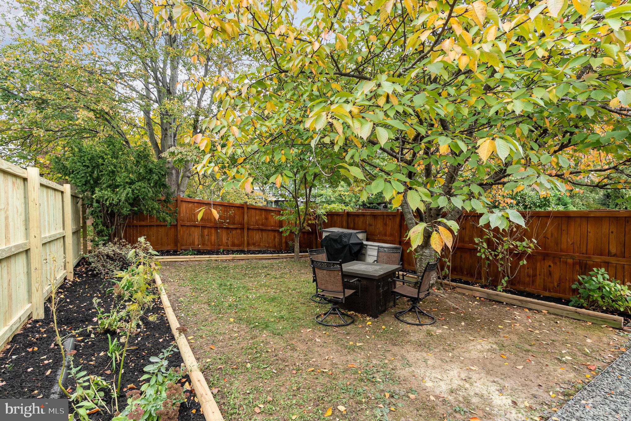 3329 Betterton Circle Abingdon, MD 21009 - Photo 3 of 38 a backyard of a house with table and chairs