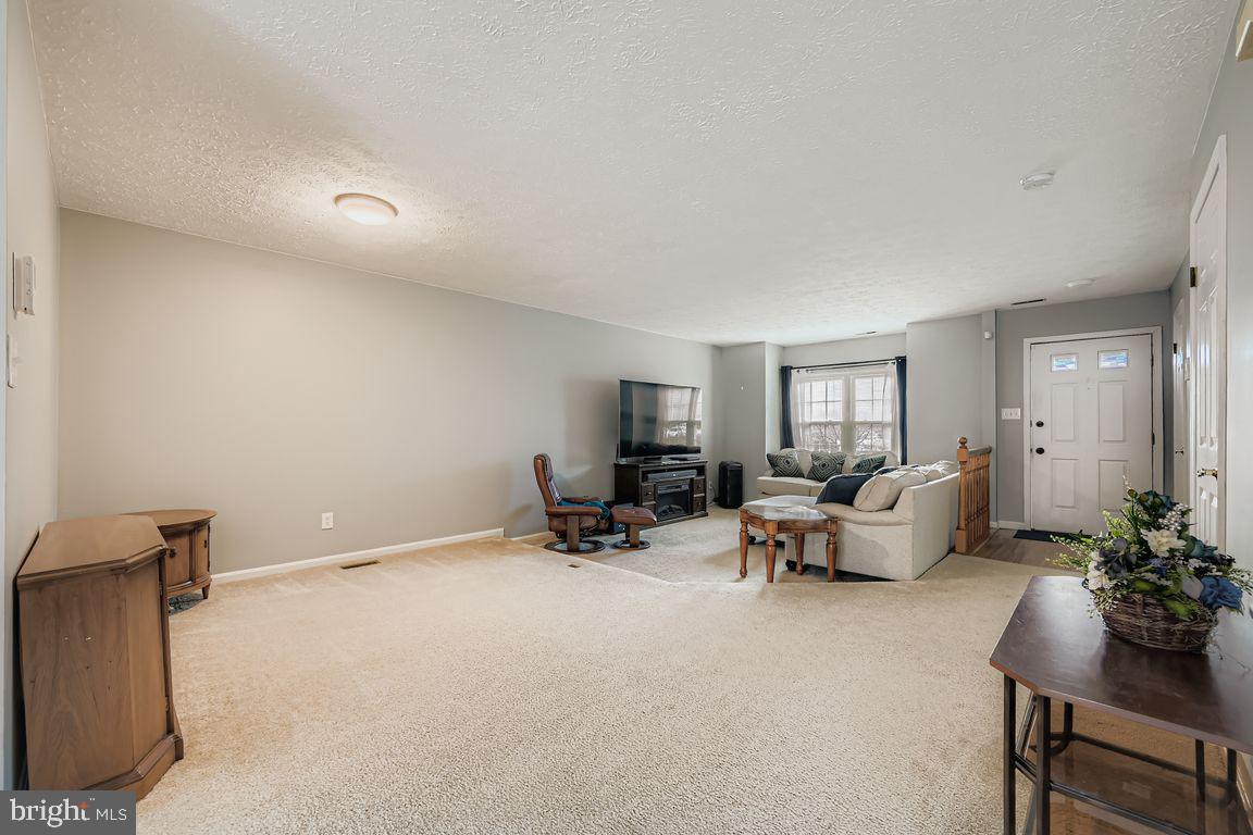 3329 Betterton Circle Abingdon, MD 21009 - Photo 7 of 38 a living room with furniture and a potted plant