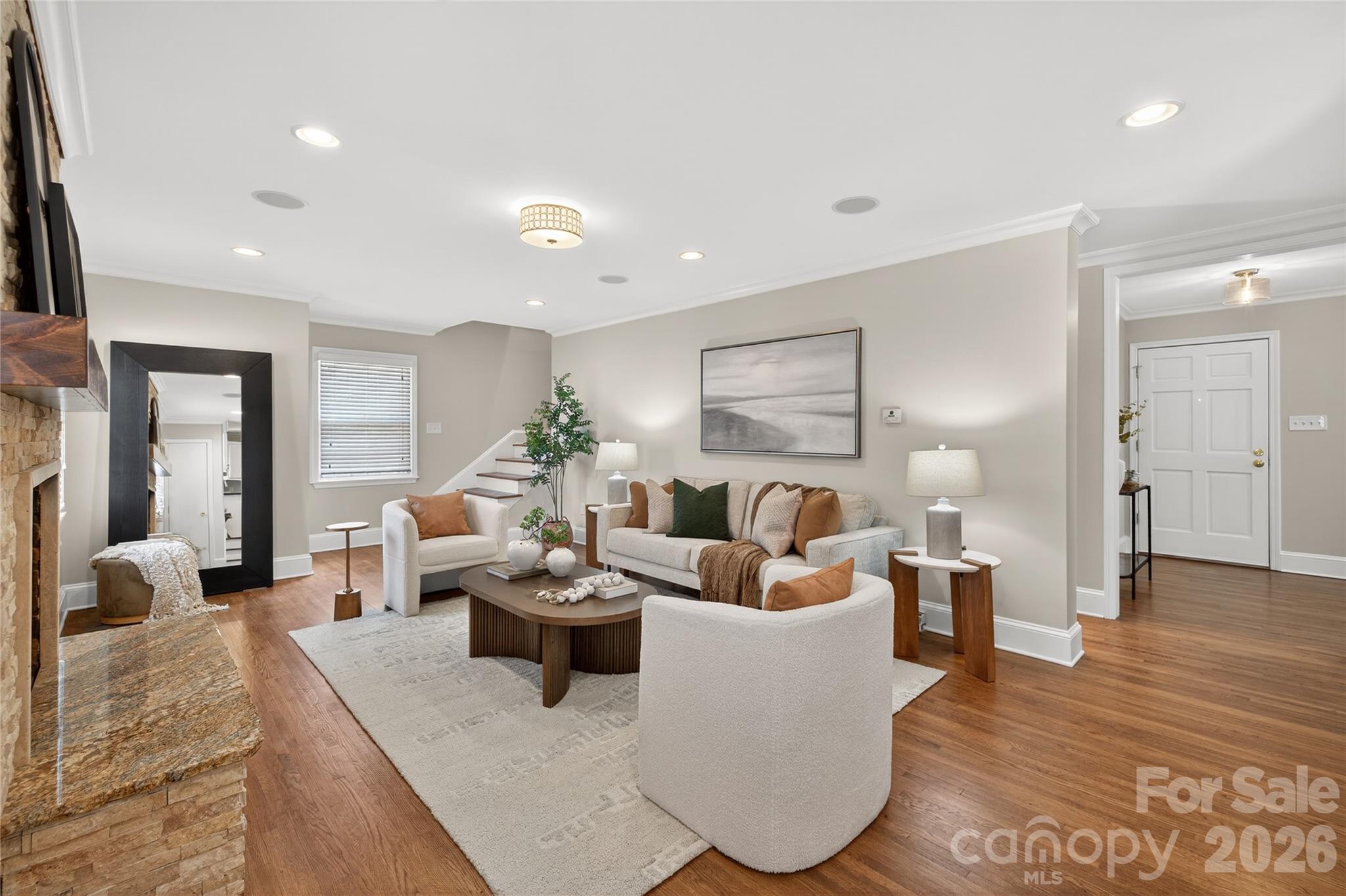 731 Sandridge Road Charlotte, NC 28210 - Photo 12 of 32 a living room with furniture and a wooden floor