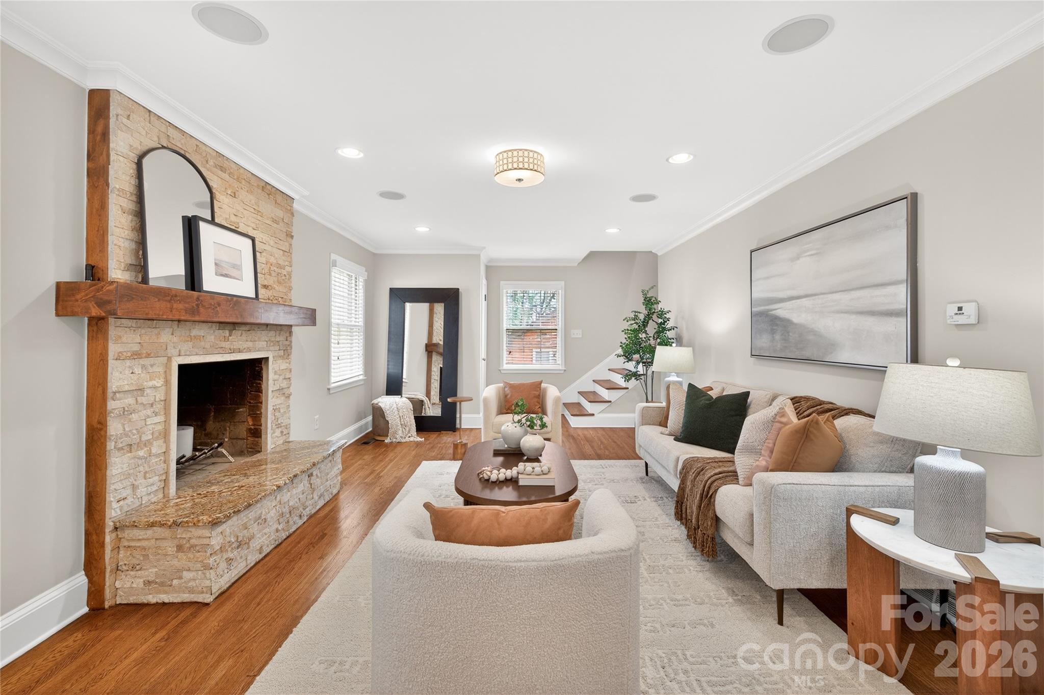 731 Sandridge Road Charlotte, NC 28210 - Photo 13 of 32 a living room with furniture and a fireplace