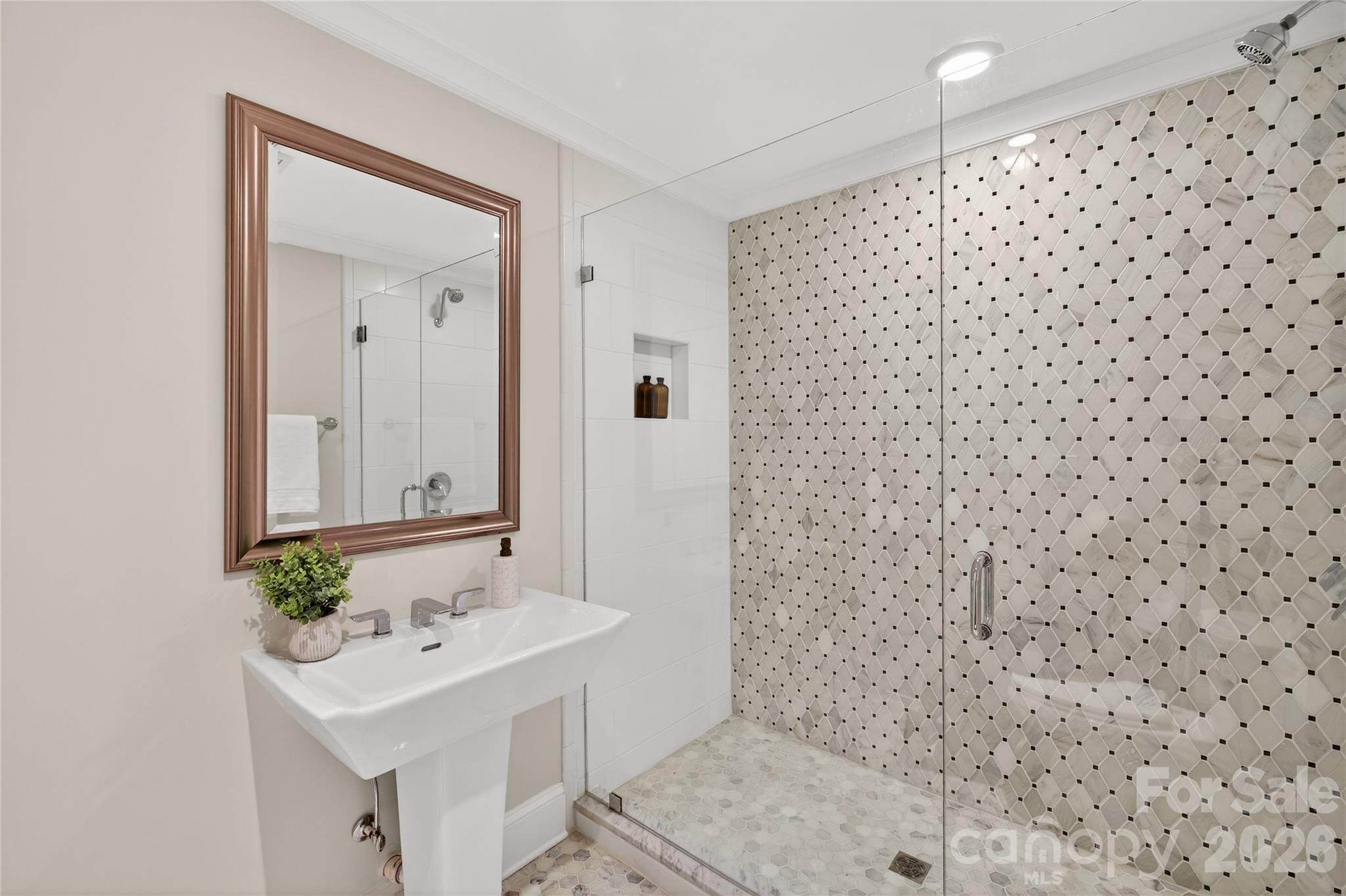 731 Sandridge Road Charlotte, NC 28210 - Photo 16 of 32 a bathroom with a sink a toilet and shower