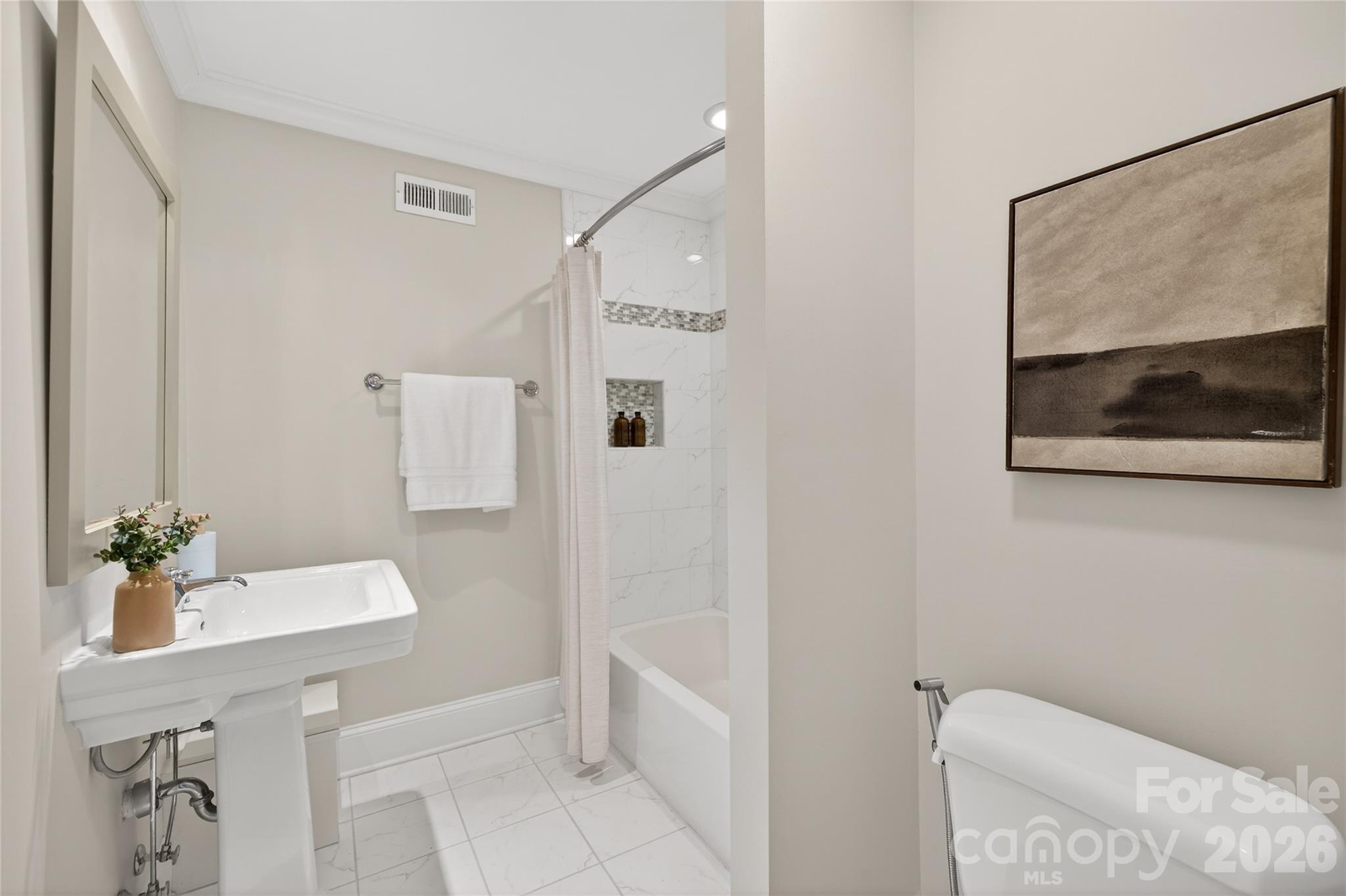 731 Sandridge Road Charlotte, NC 28210 - Photo 26 of 32 a bathroom with a sink and a mirror