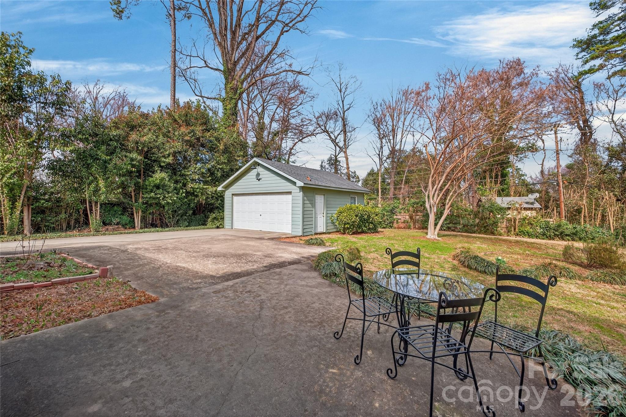 731 Sandridge Road Charlotte, NC 28210 - Photo 29 of 32 a view of house with backyard and seating space