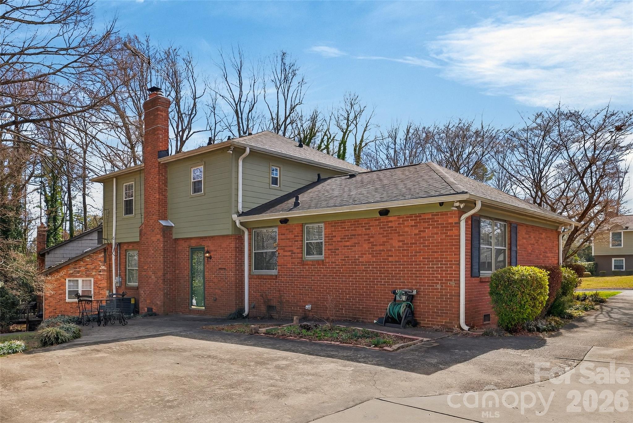731 Sandridge Road Charlotte, NC 28210 - Photo 30 of 32 a front view of a house with a yard and garage