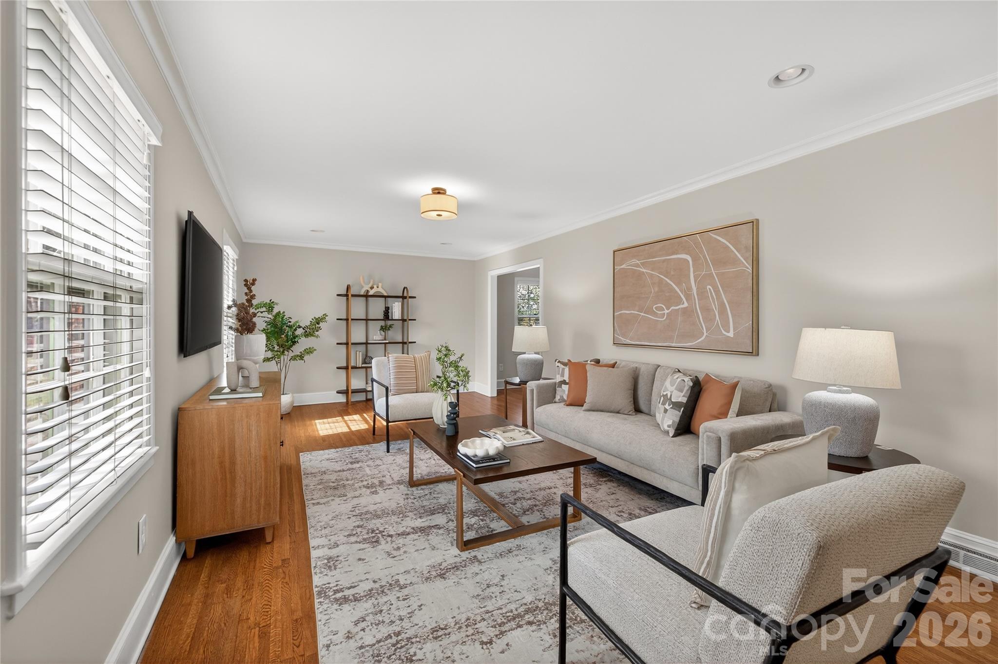 731 Sandridge Road Charlotte, NC 28210 - Photo 3 of 32 a living room with furniture and a wooden floor