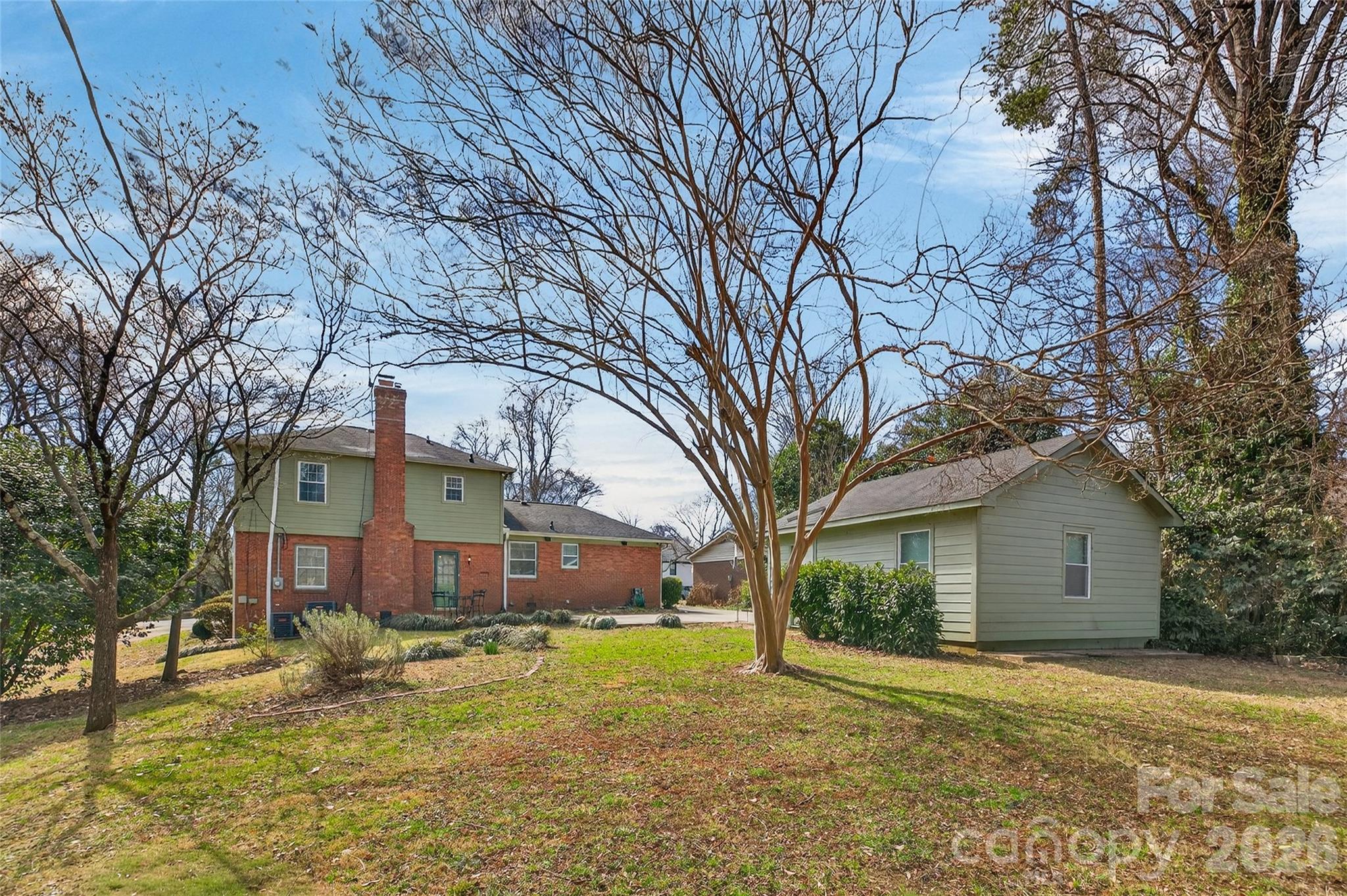 731 Sandridge Road Charlotte, NC 28210 - Photo 31 of 32 a view of a house with a yard covered with snow