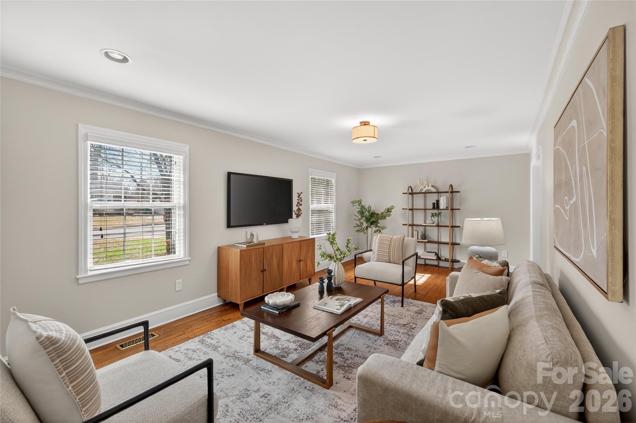 731 Sandridge Road Charlotte, NC 28210 - Photo 4 of 32 a living room with furniture and a flat screen tv
