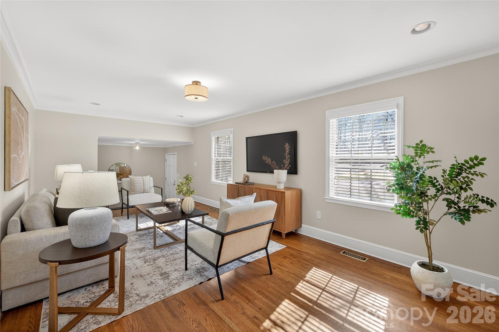 731 Sandridge Road Charlotte, NC 28210 - Photo 5 of 32 a living room with furniture potted plant and a window