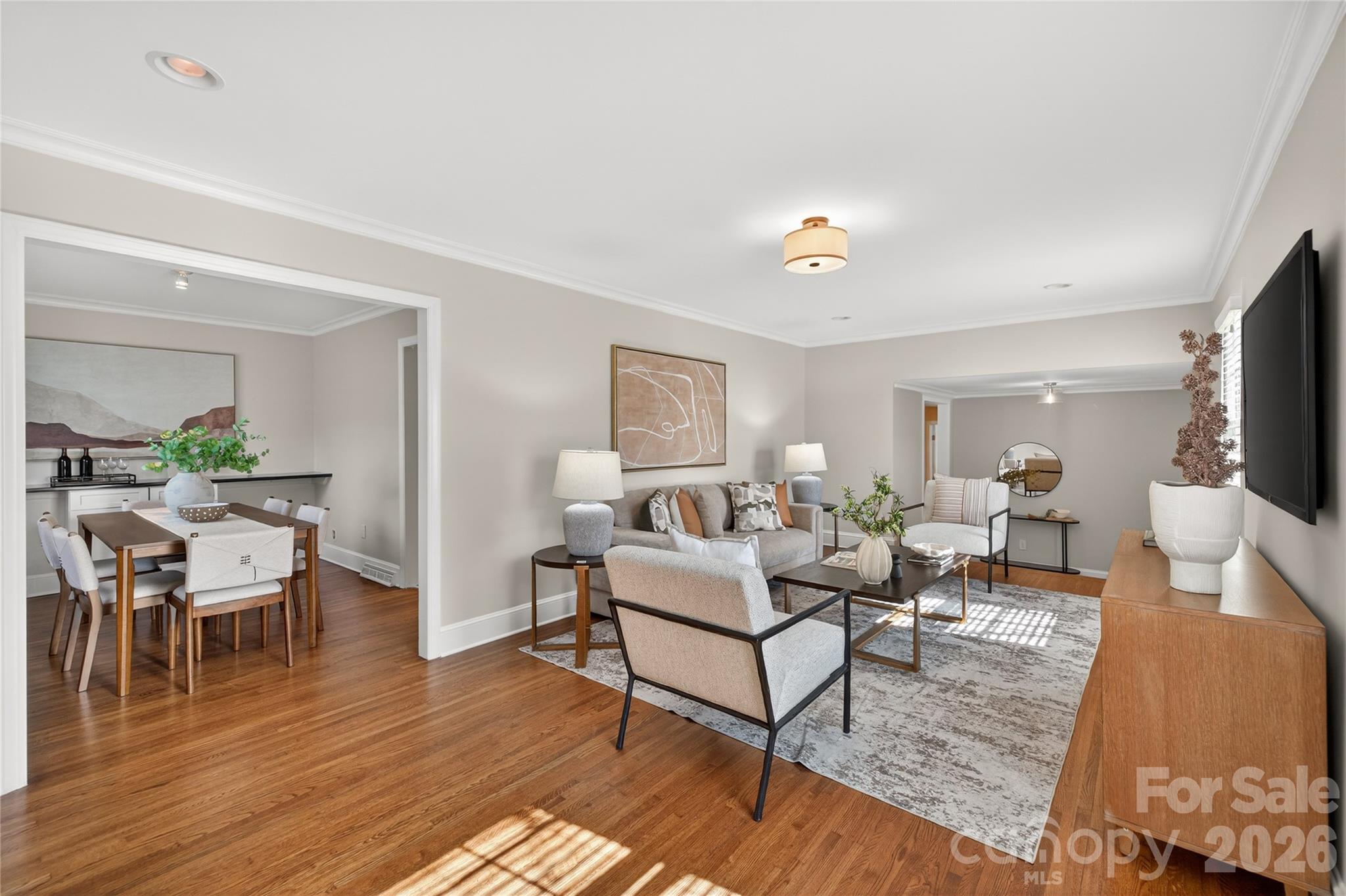 731 Sandridge Road Charlotte, NC 28210 - Photo 6 of 32 a living room with furniture and a flat screen tv
