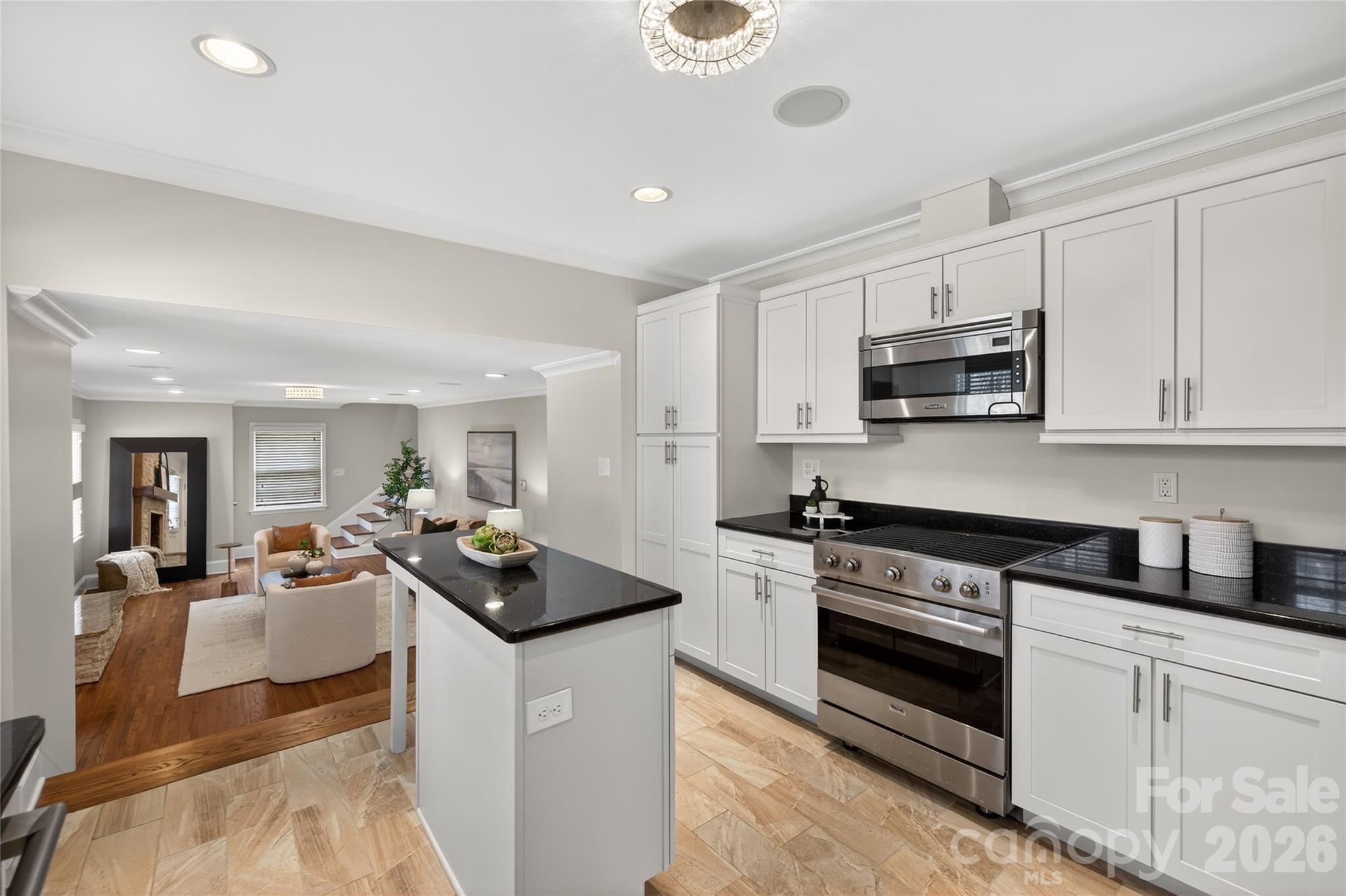 731 Sandridge Road Charlotte, NC 28210 - Photo 9 of 32 a kitchen with sink cabinets and stove top oven