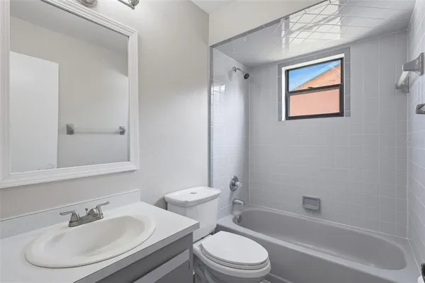 a bathroom with a toilet a sink and a bathtub