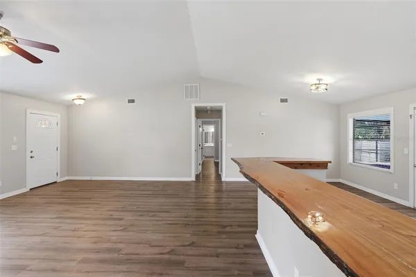 a view of a kitchen cabinets and a wooden floor