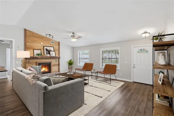 a living room with furniture and a fireplace