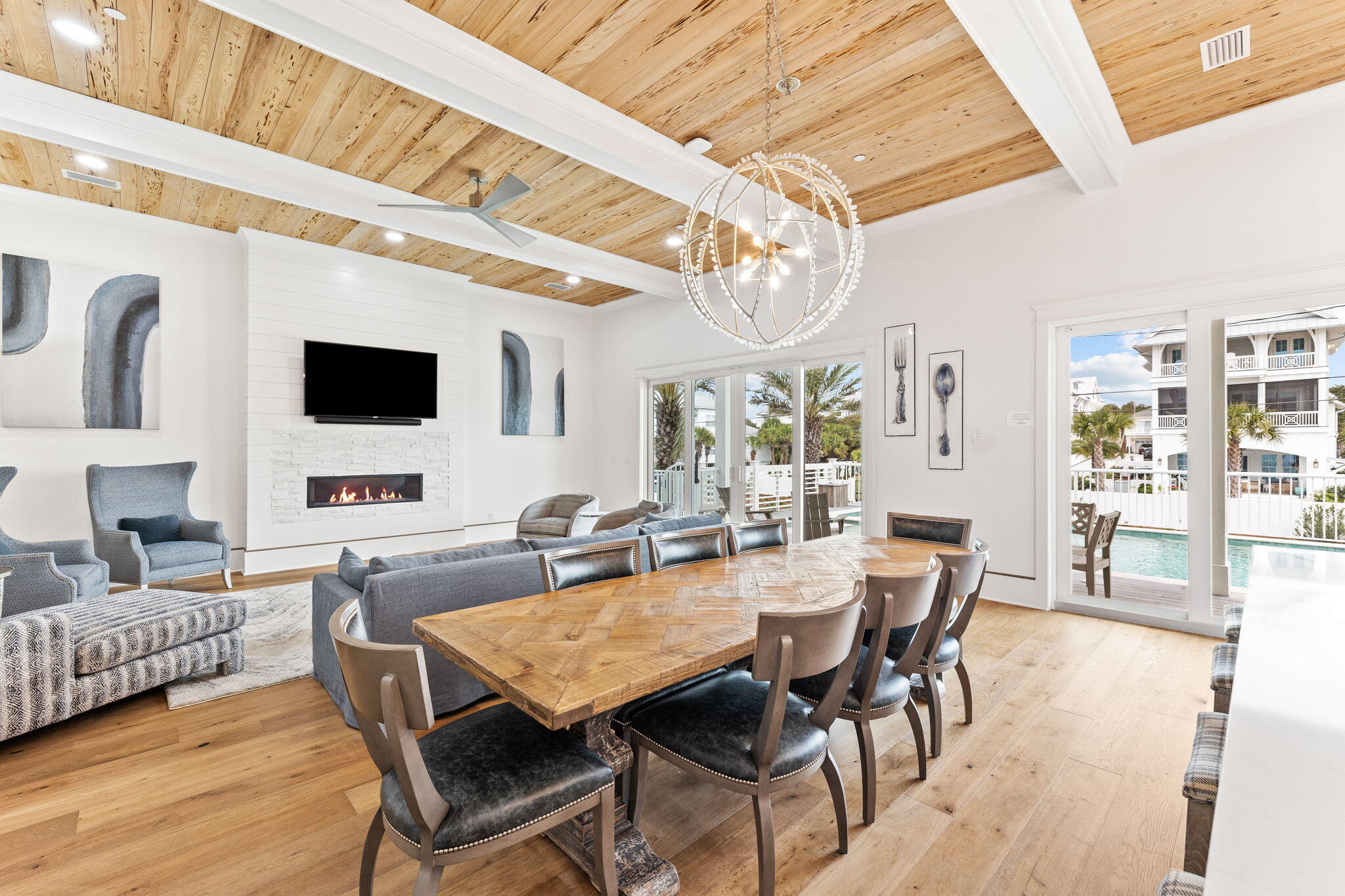 6 Palm Ct Lane Inlet Beach, FL 32461 - Photo 15 of 65 a dining room with furniture a chandelier and wooden floor