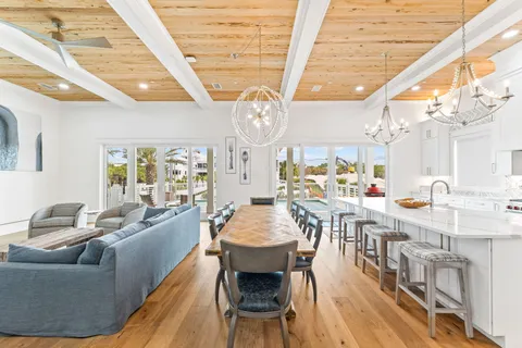 a view of a house with swimming pool and porch with furniture