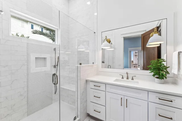 a bathroom with double sink and a mirror