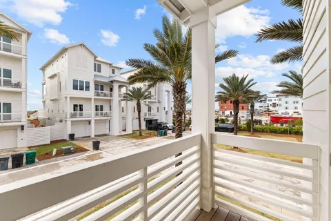 a view of a balcony with wooden floor