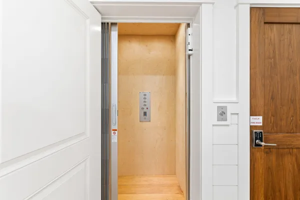 a kitchen with stainless steel appliances granite countertop a stove and a wooden floors