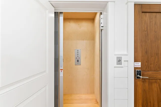 a kitchen with stainless steel appliances granite countertop a stove and a wooden floors