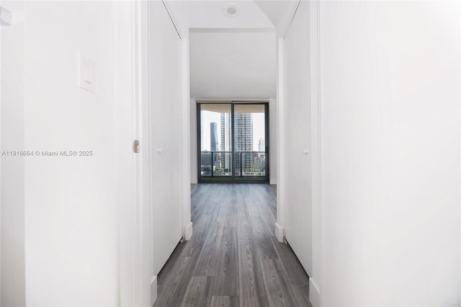 45 Southwest 9th Street, Unit 1504 Miami, FL 33130 - Photo 18 of 33 a view of a hallway with wooden floor