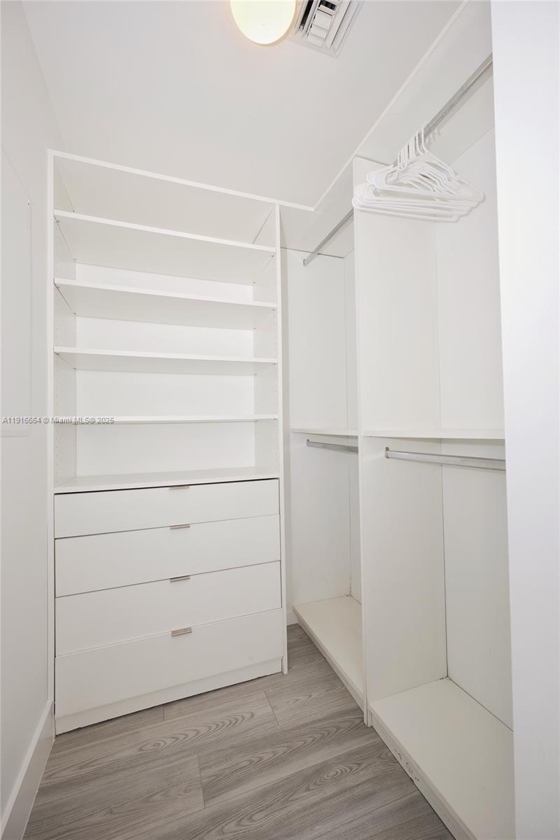 45 Southwest 9th Street, Unit 1504 Miami, FL 33130 - Photo 21 of 33 a view of walk in closet with empty racks
