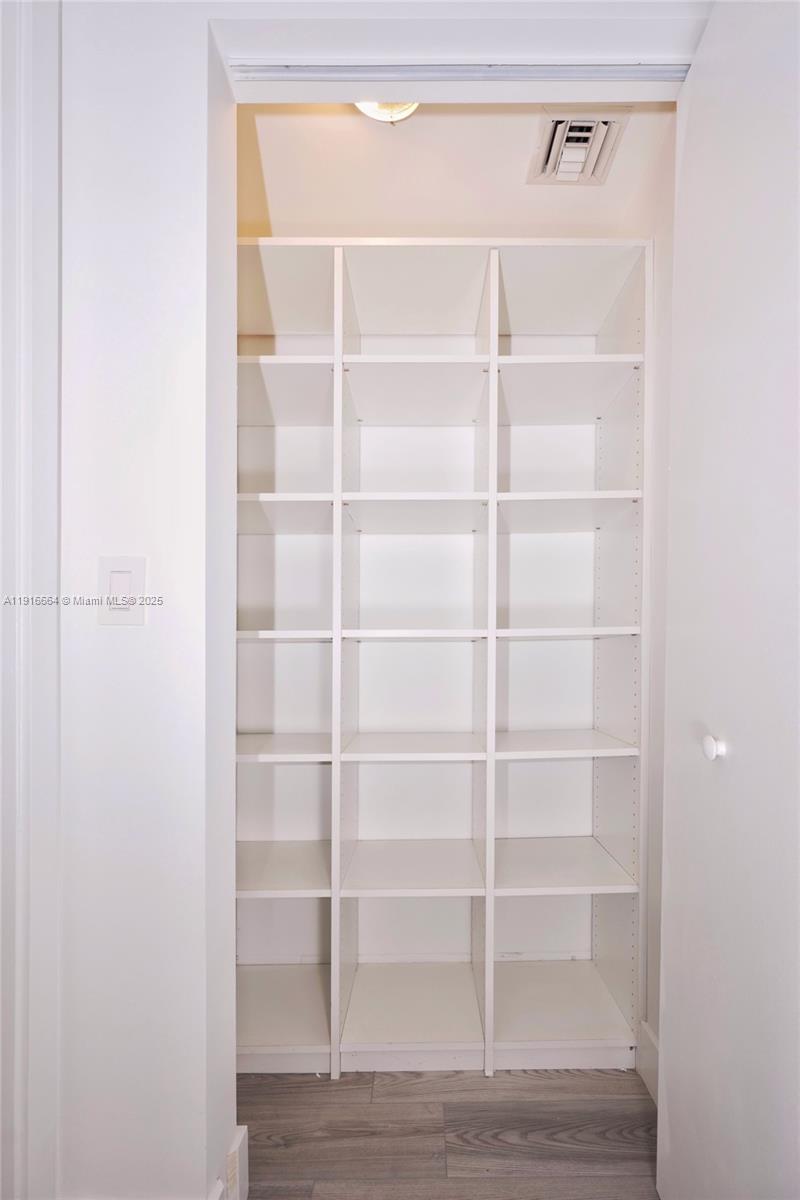 45 Southwest 9th Street, Unit 1504 Miami, FL 33130 - Photo 22 of 33 a view of a room with empty racks