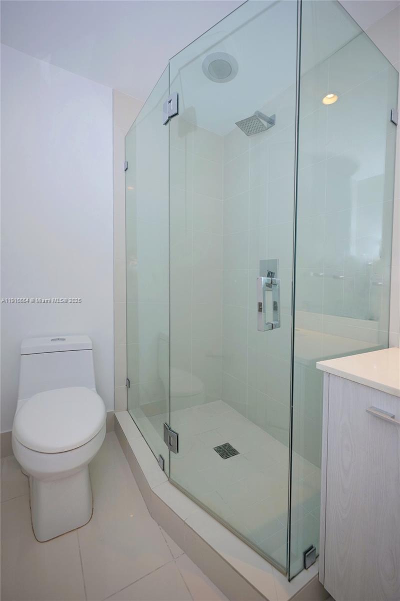 45 Southwest 9th Street, Unit 1504 Miami, FL 33130 - Photo 26 of 33 a bathroom with a shower and a toilet