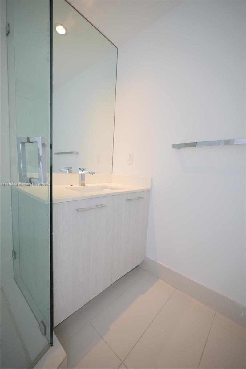 45 Southwest 9th Street, Unit 1504 Miami, FL 33130 - Photo 27 of 33 a room with a sink and a washer dryer