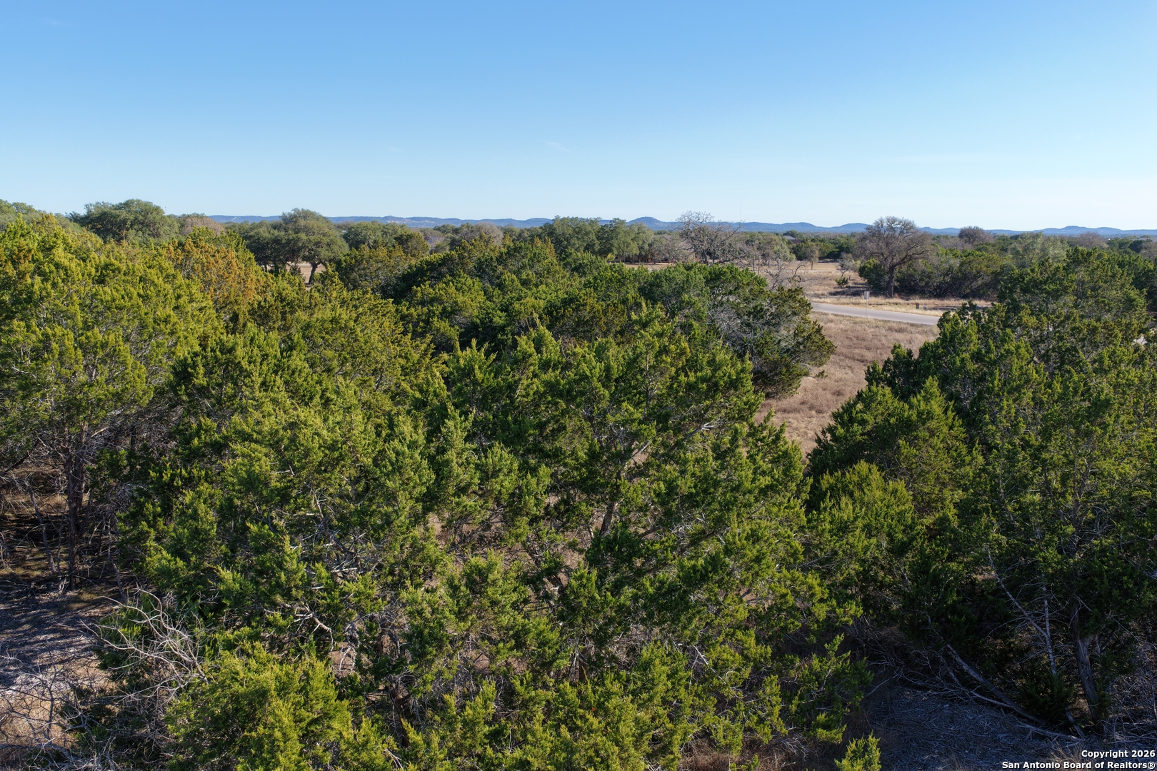 Parcel 1 Rio Lantana Drive Pipe Creek, TX 78063 - Photo 11 of 31 a view of a house with a mountain in the background