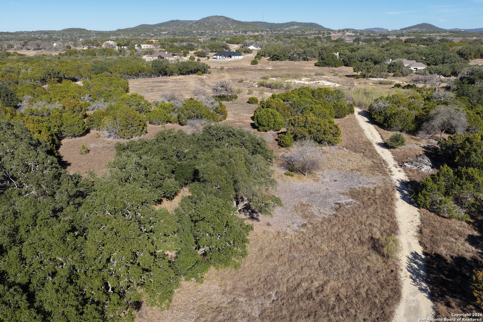 Parcel 1 Rio Lantana Drive Pipe Creek, TX 78063 - Photo 12 of 31 a view of a lake with mountains in the background