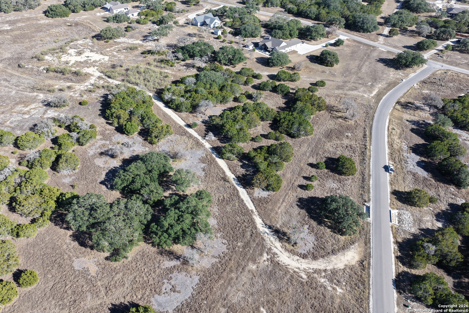 Parcel 1 Rio Lantana Drive Pipe Creek, TX 78063 - Photo 7 of 31 an aerial view of residential house with pool and trees all around