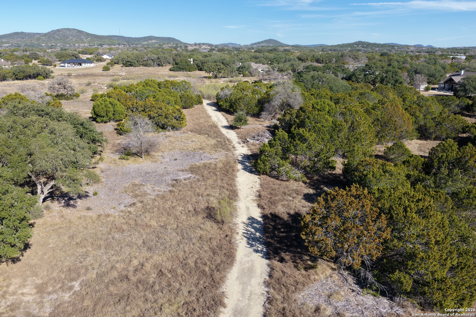 Parcel 1 Rio Lantana Drive Pipe Creek, TX 78063 - Photo 8 of 31 a view of a lake with mountains in the background