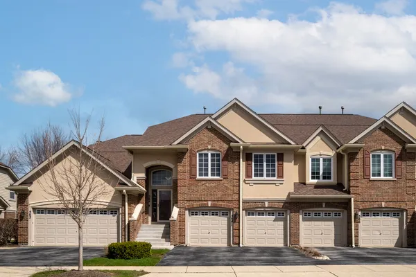 a front view of a house with yard