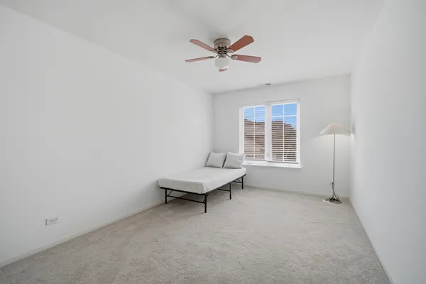 a living room with furniture and windows