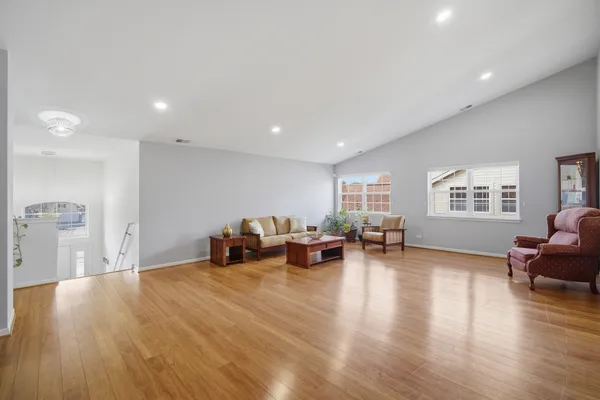a room with furniture and wooden floor