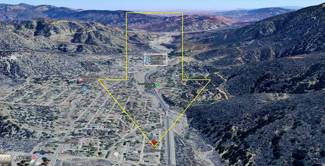 a aerial view of a house with a yard