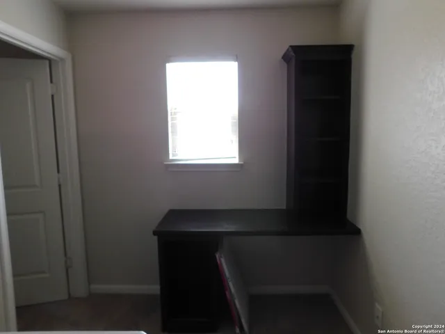 a view of a backyard with a small pool