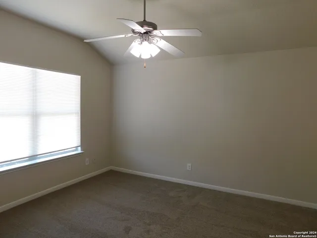 a bathroom with a sink a toilet and a window