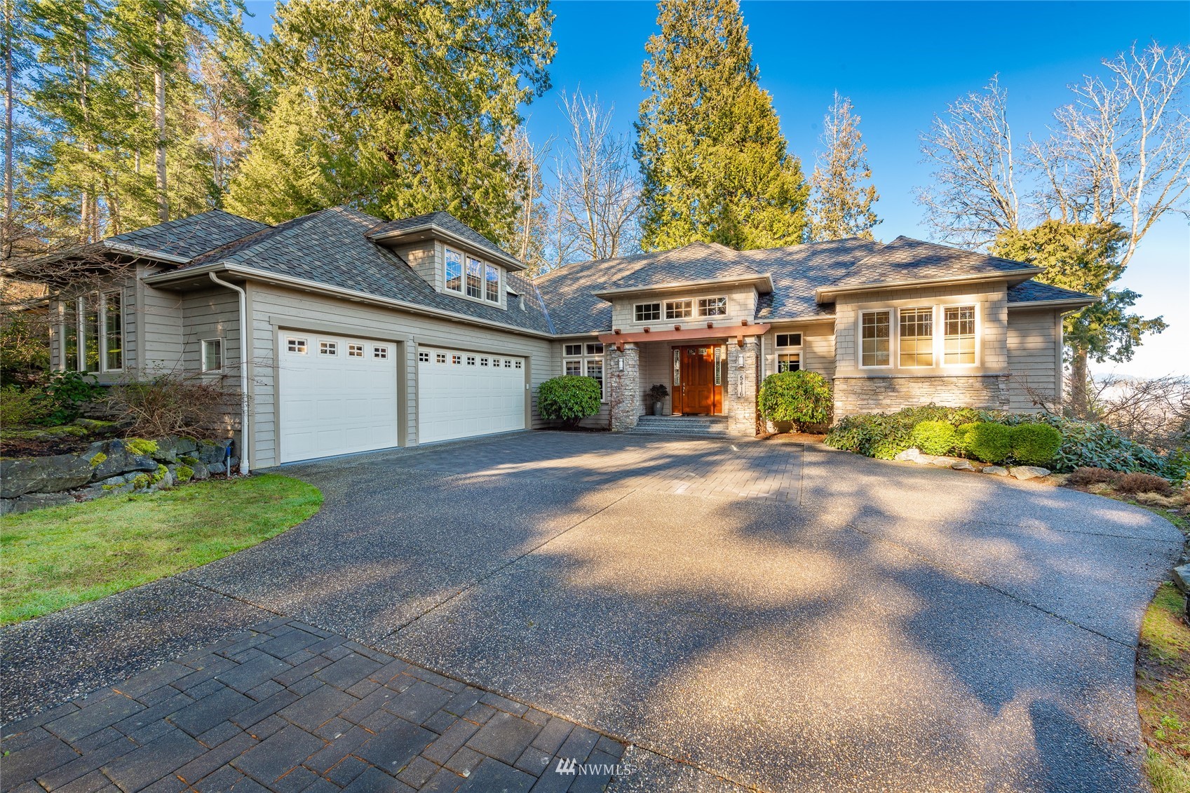 5416 Canvasback Road Blaine, WA 98230 - Photo 1 of 12 a front view of a house with a yard and potted plants