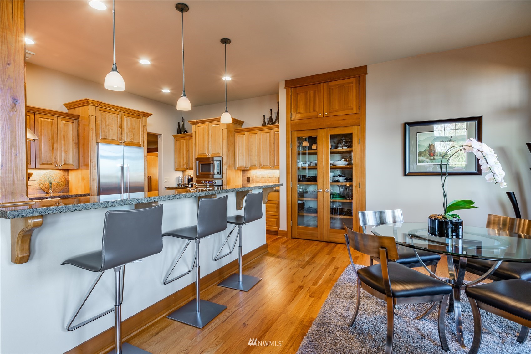 5416 Canvasback Road Blaine, WA 98230 - Photo 4 of 12 a living room with furniture kitchen view and a wooden floor