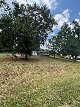 a view of outdoor space with deck and trees