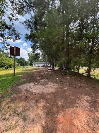 a view of a road with a building in the background