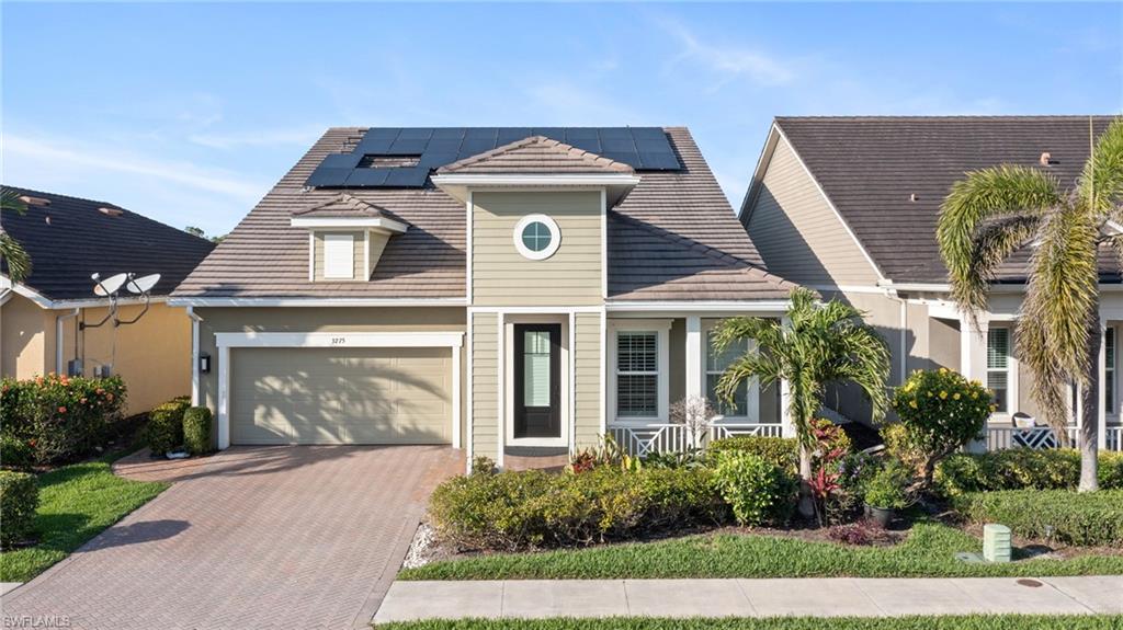 3275 Pilot Circle Naples, FL 34120 - Photo 1 of 44 front view of house with a yard