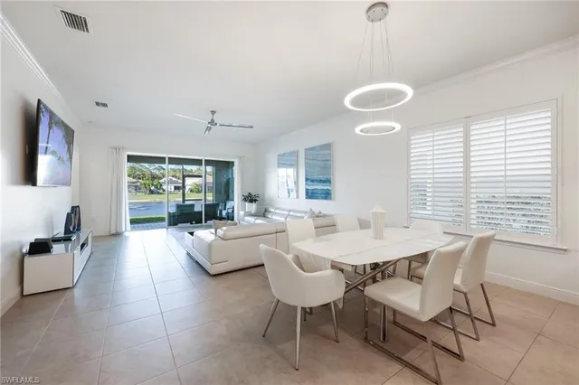 a view of a dining room with furniture and window