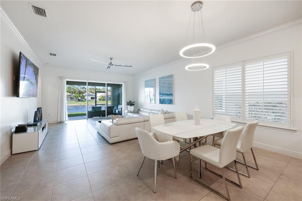 3275 Pilot Circle Naples, FL 34120 - Photo 11 of 44 a view of a dining room with furniture and window